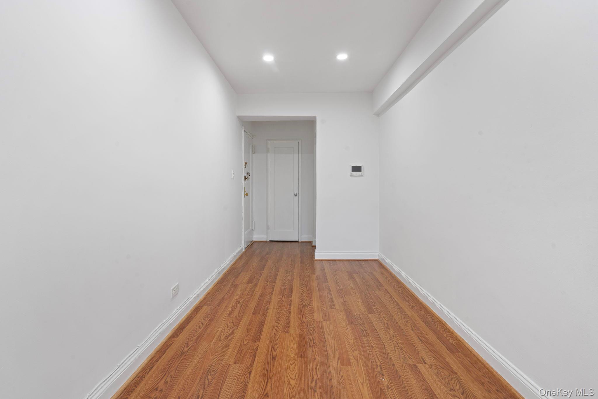32-40 89th Street, Unit C409 Queens, NY 11369 - Photo 8 of 32 a view of a room with wooden floor