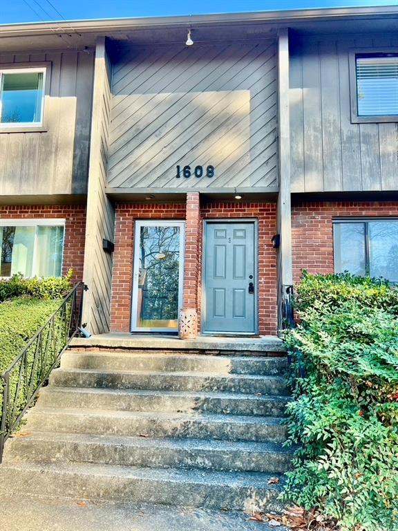 1608 Briarcliff Road Northeast, Unit 3 Atlanta, GA 30306 - Photo 1 of 1 a front view of a house with a yard