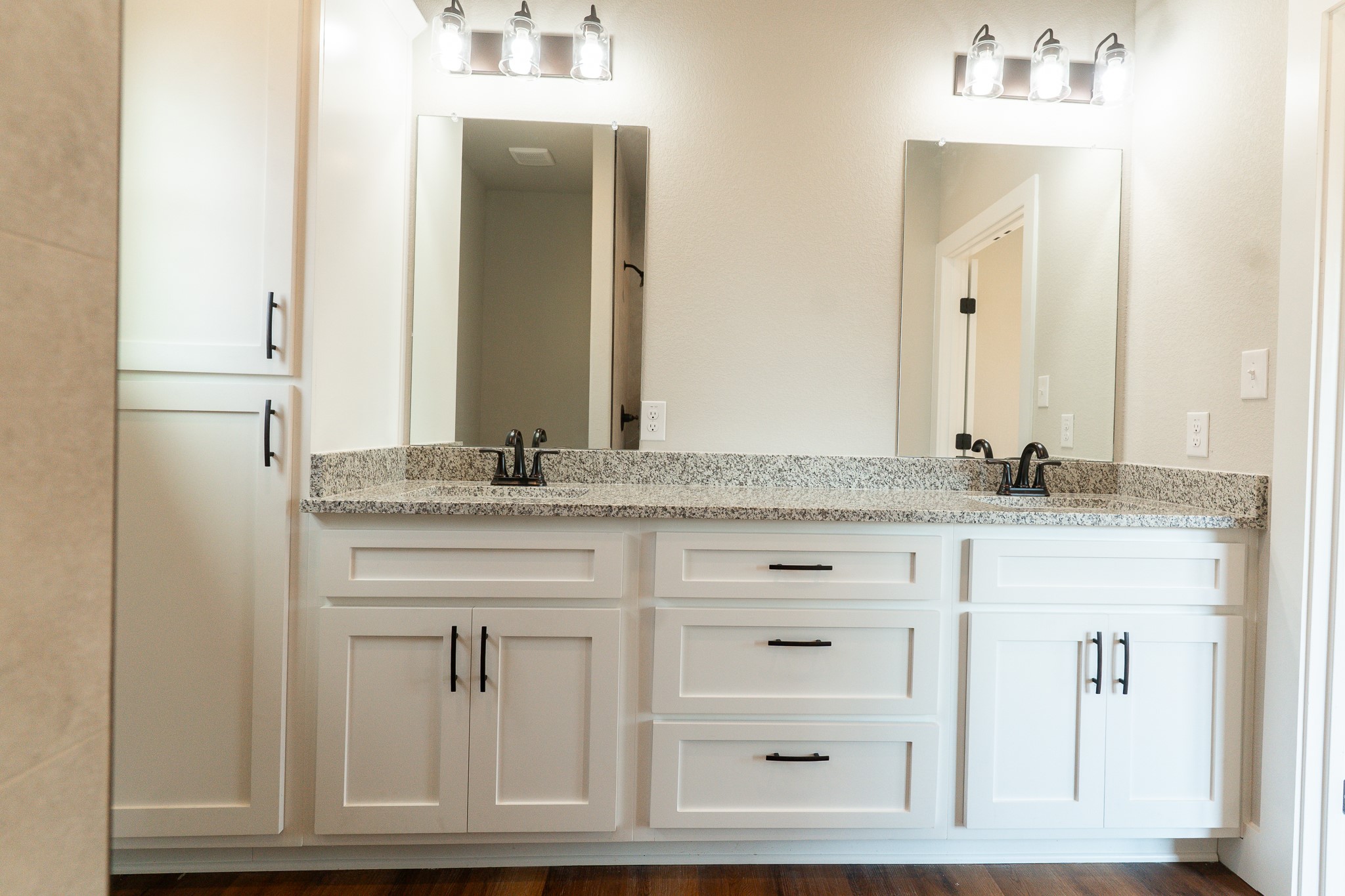 305 String Prairie Way Smithville, TX 78957 - Photo 16 of 26 a bathroom with a granite countertop sink and a mirror