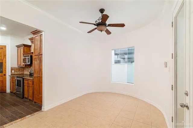 a view of a kitchen with a sink refrigerator and wooden floor
