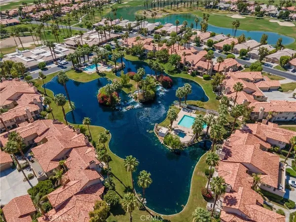 an aerial view of a house with a swimming pool yard and outdoor seating