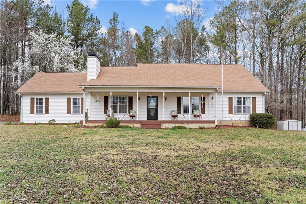 1725 North Stockmar Road Villa Rica, GA 30180 - Photo 1 of 1 a front view of a house with a garden