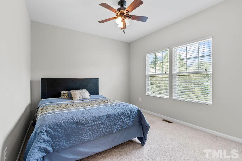 833 Davidson Point Road Cary, NC 27513 - Photo 31 of 35 a bedroom with a bed and window