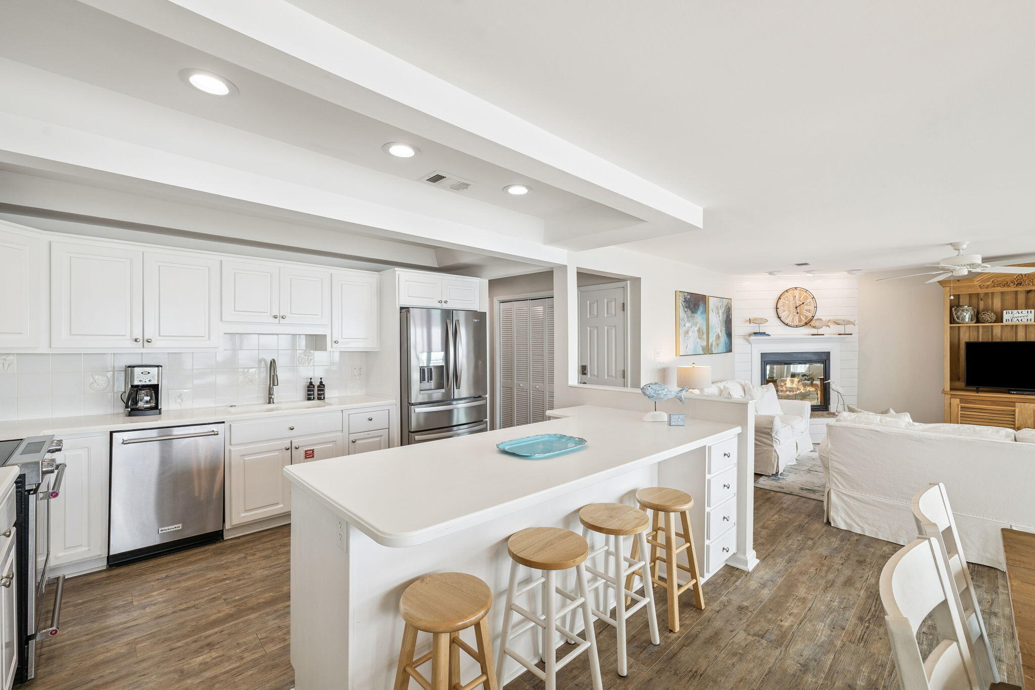 142 Beachside Drive, Unit 10 Santa Rosa Beach, FL 32459 - Photo 13 of 42 a kitchen with stainless steel appliances a table and chairs in it