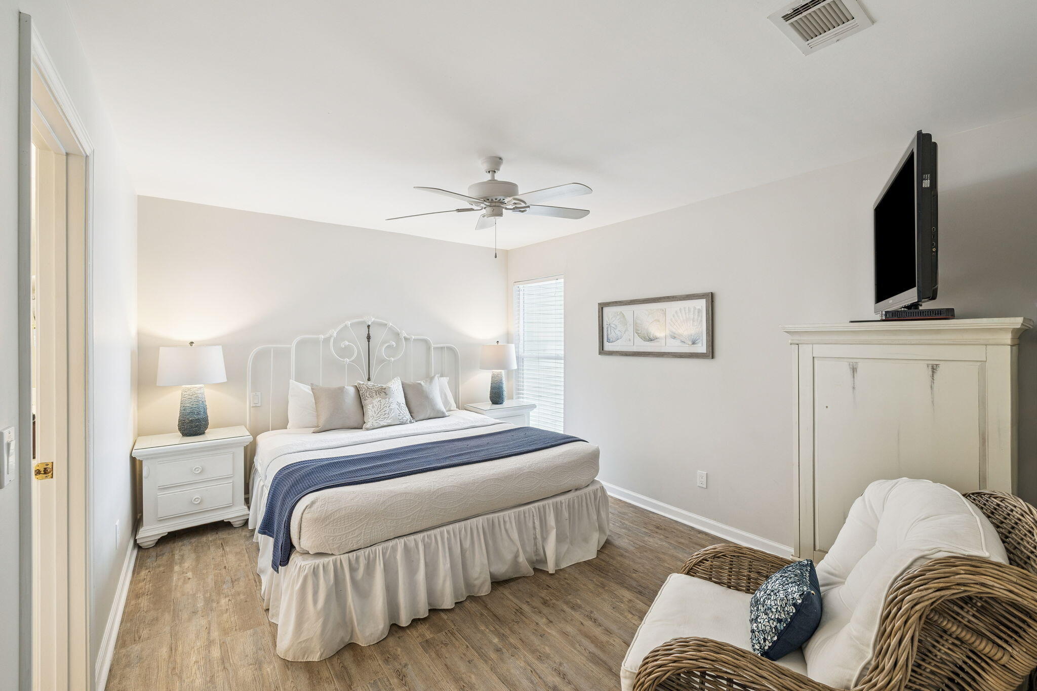 142 Beachside Drive, Unit 10 Santa Rosa Beach, FL 32459 - Photo 19 of 42 a bedroom with a bed and a flat screen tv