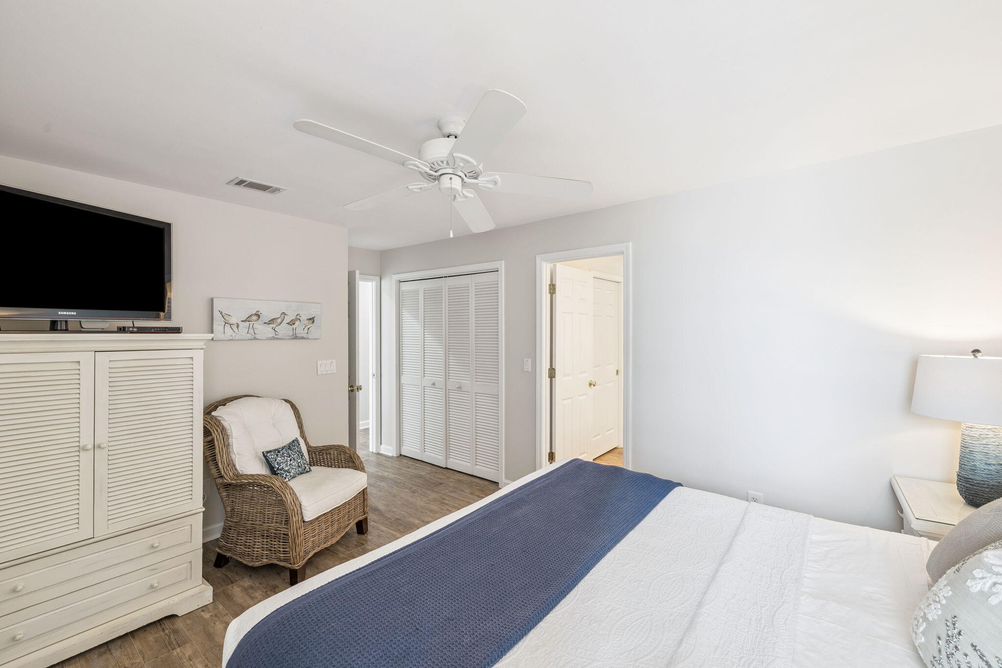 142 Beachside Drive, Unit 10 Santa Rosa Beach, FL 32459 - Photo 20 of 42 a bedroom with a bed and a flat screen tv