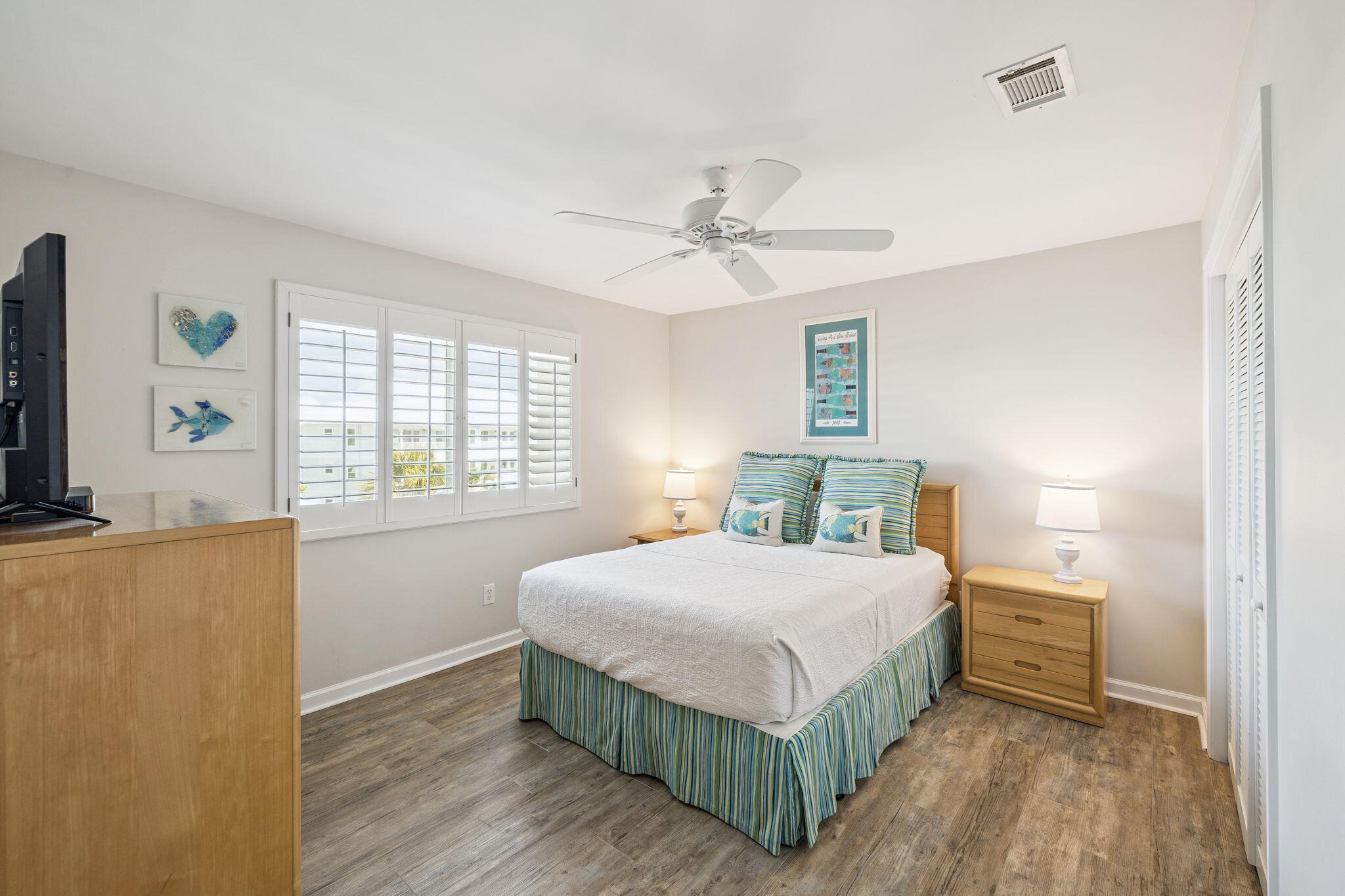 142 Beachside Drive, Unit 10 Santa Rosa Beach, FL 32459 - Photo 25 of 42 a bedroom with a bed dresser and a window