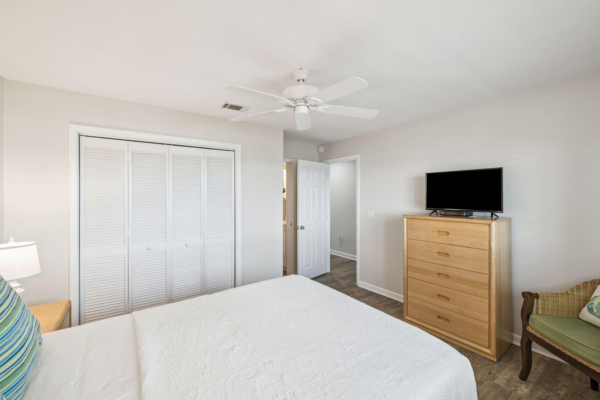 142 Beachside Drive, Unit 10 Santa Rosa Beach, FL 32459 - Photo 26 of 42 a bedroom with a bed and a flat screen tv