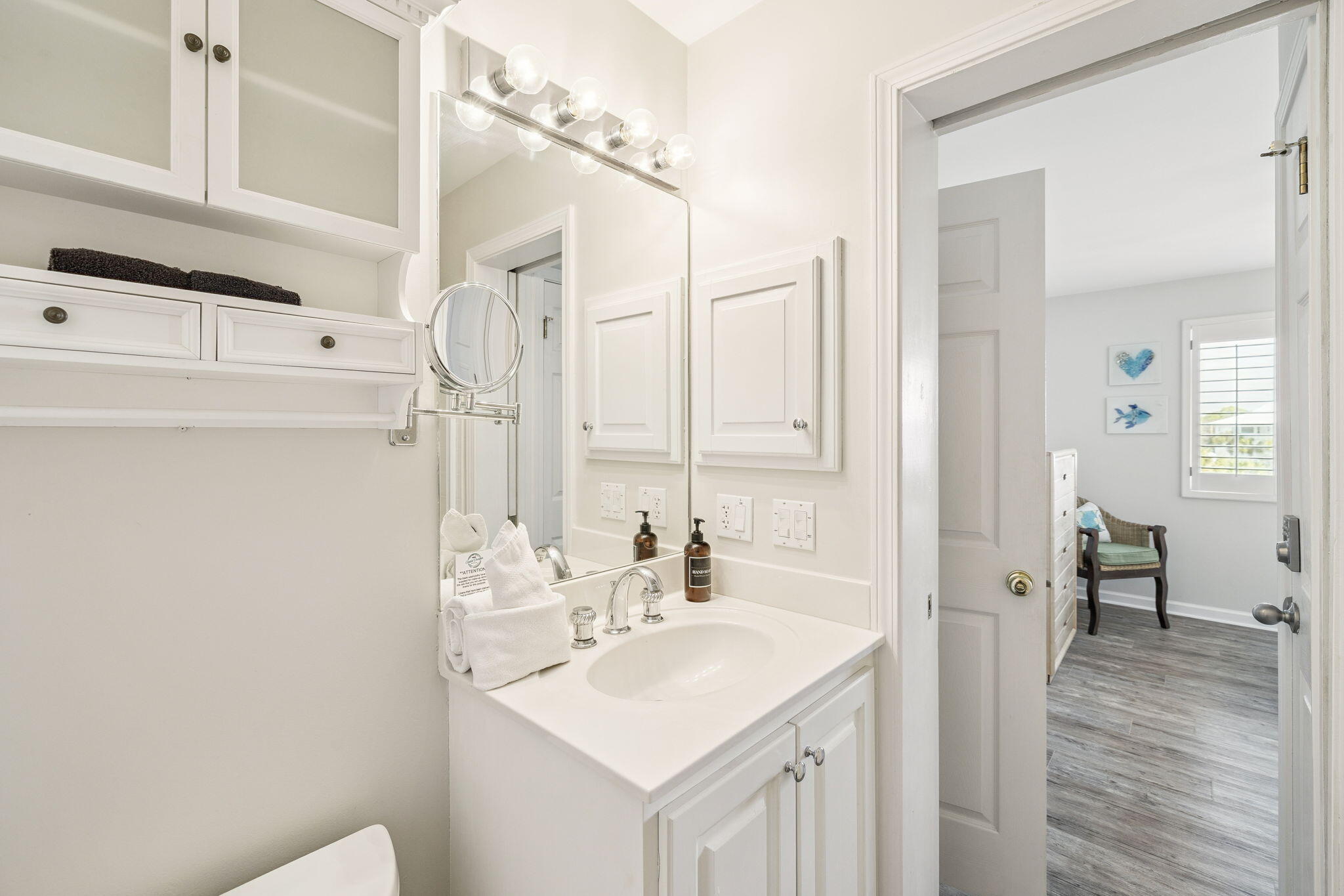 142 Beachside Drive, Unit 10 Santa Rosa Beach, FL 32459 - Photo 27 of 42 a bathroom with a sink a mirror and a shower