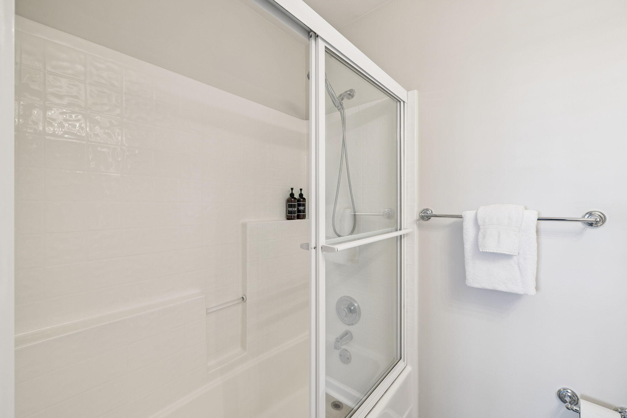 142 Beachside Drive, Unit 10 Santa Rosa Beach, FL 32459 - Photo 28 of 42 a bathroom with a shower and a glass door