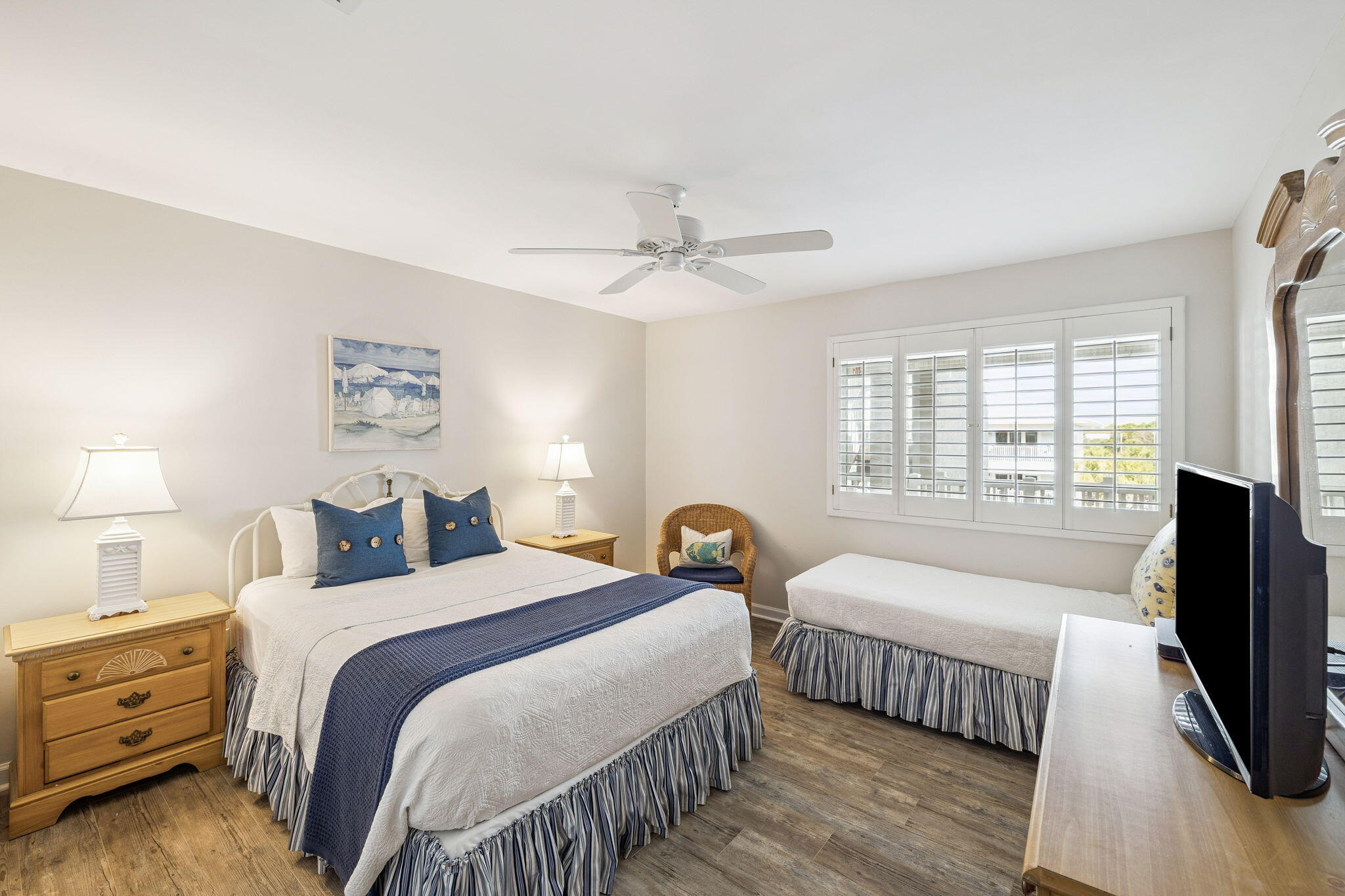 142 Beachside Drive, Unit 10 Santa Rosa Beach, FL 32459 - Photo 29 of 42 a bedroom with two beds and a flat tv screen on dresser