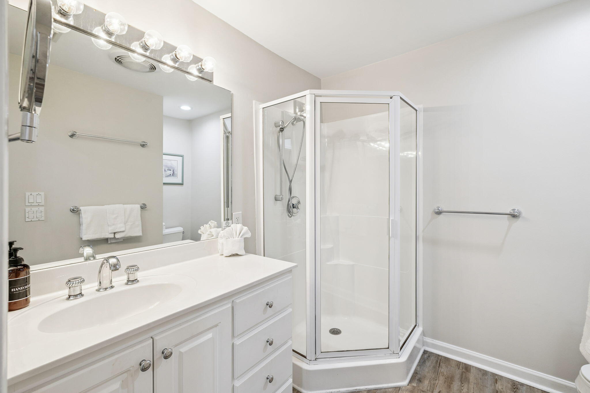 142 Beachside Drive, Unit 10 Santa Rosa Beach, FL 32459 - Photo 31 of 42 a bathroom with a double vanity sink mirror and shower