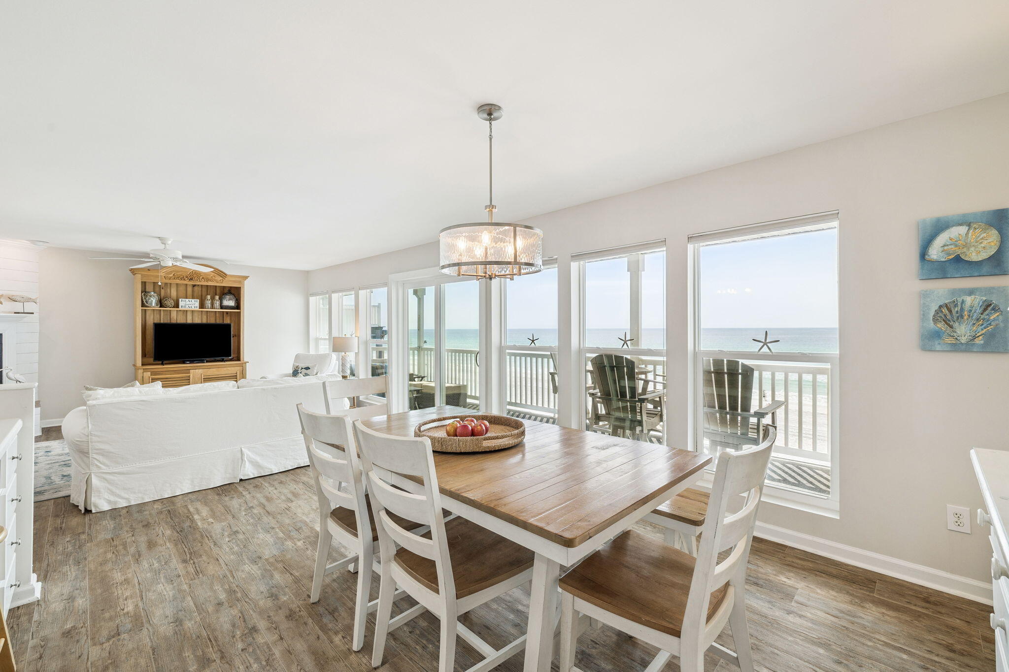 142 Beachside Drive, Unit 10 Santa Rosa Beach, FL 32459 - Photo 8 of 42 a view of a dining room with furniture large windows and wooden floor