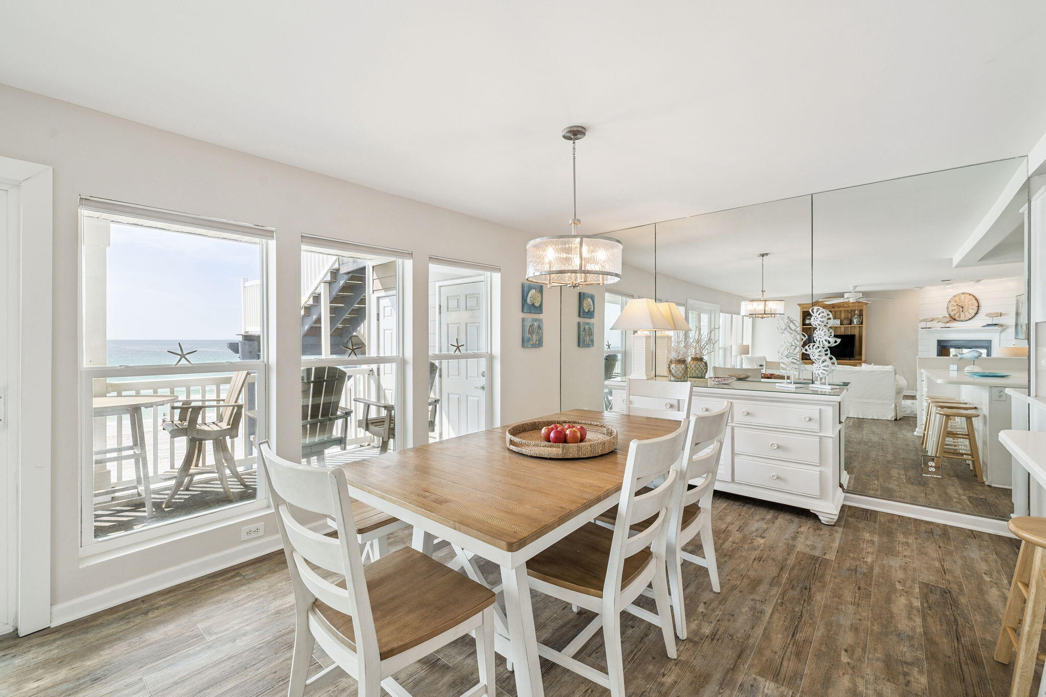 142 Beachside Drive, Unit 10 Santa Rosa Beach, FL 32459 - Photo 10 of 42 a kitchen with white cabinets and wooden floor