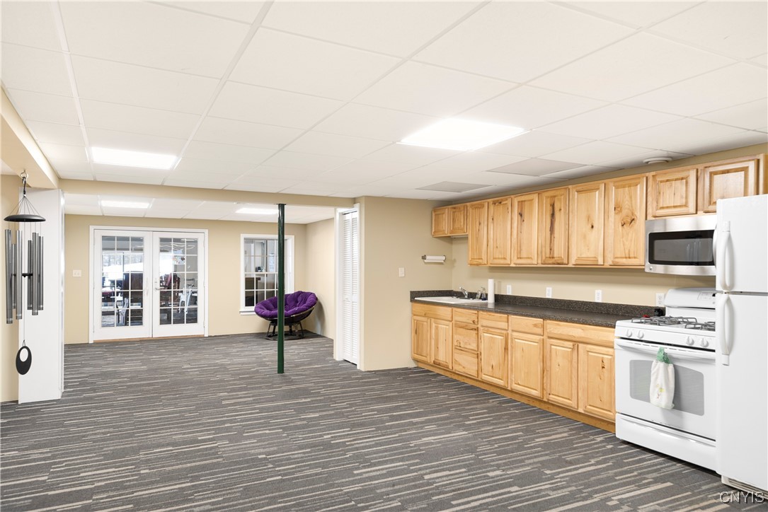 4873 Lawless Road Marcellus, NY 13108 - Photo 29 of 49 finished basement with full kitchen