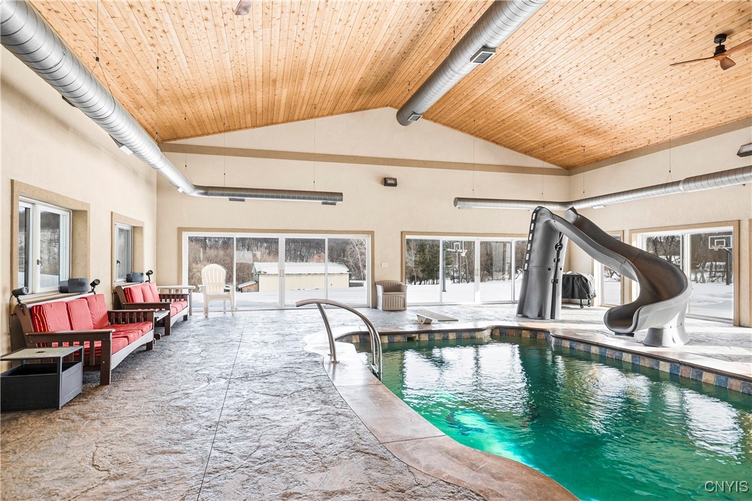 4873 Lawless Road Marcellus, NY 13108 - Photo 34 of 49 indoor pool with slide