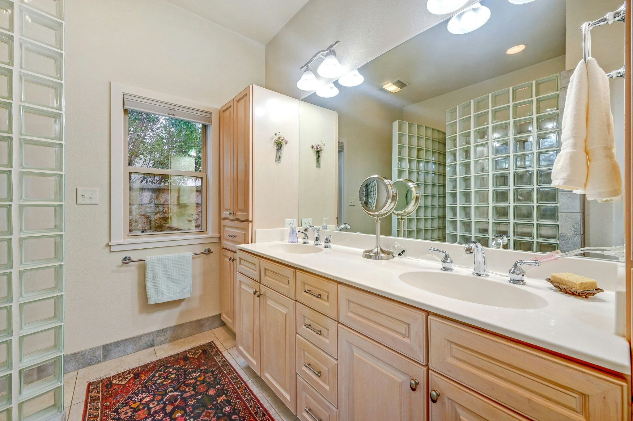 2147 Tejas Trail Blanco, TX 78606 - Photo 14 of 29 a bathroom with a sink double vanity and a shower