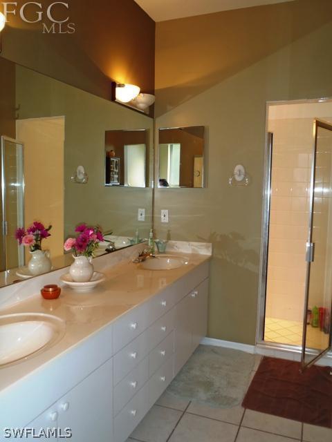 17549 Allentown Road Fort Myers, FL 33967 - Photo 7 of 14 a bathroom with a granite countertop sink and a mirror