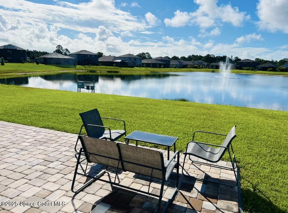 841 Old Country Rd S East Palm Bay, FL 32909 - Photo 12 of 16 a view of a lake with a table and chairs