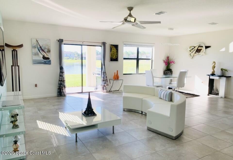 841 Old Country Rd S East Palm Bay, FL 32909 - Photo 6 of 16 a living room with fireplace furniture and a large window