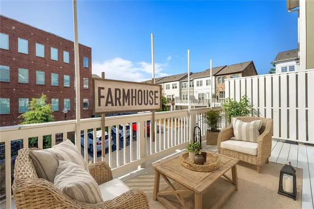 a view of a balcony with furniture