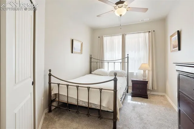 a bedroom with a bed and a cabinets