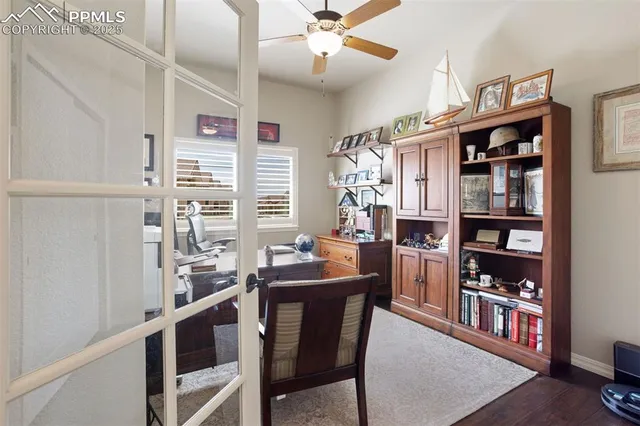 a view of a dining room with furniture and a window