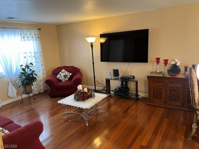 415 Wheatsheaf Road Roselle, NJ 07203 - Photo 12 of 30 a living room with furniture and a flat screen tv