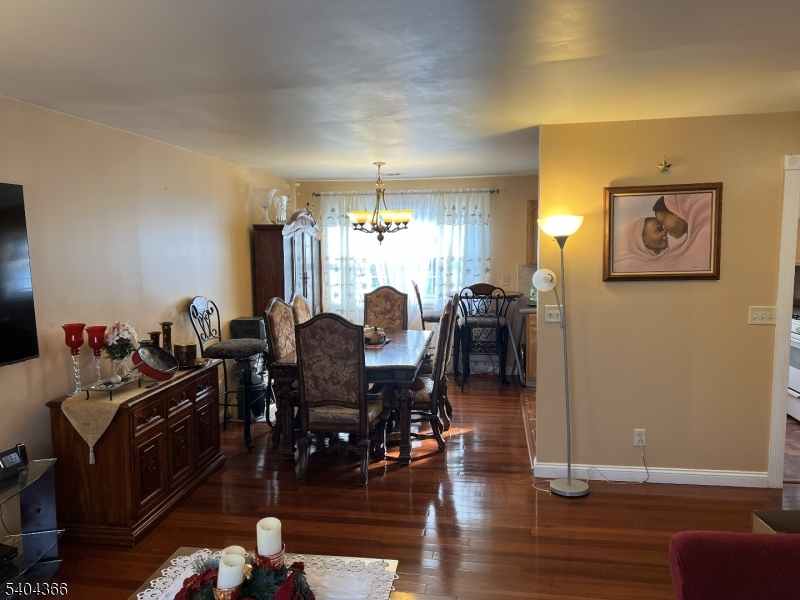 415 Wheatsheaf Road Roselle, NJ 07203 - Photo 14 of 30 a view of a dining room with furniture and chandelier