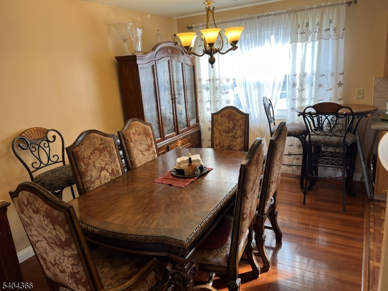 415 Wheatsheaf Road Roselle, NJ 07203 - Photo 15 of 30 a view of a dining room with furniture and chandelier