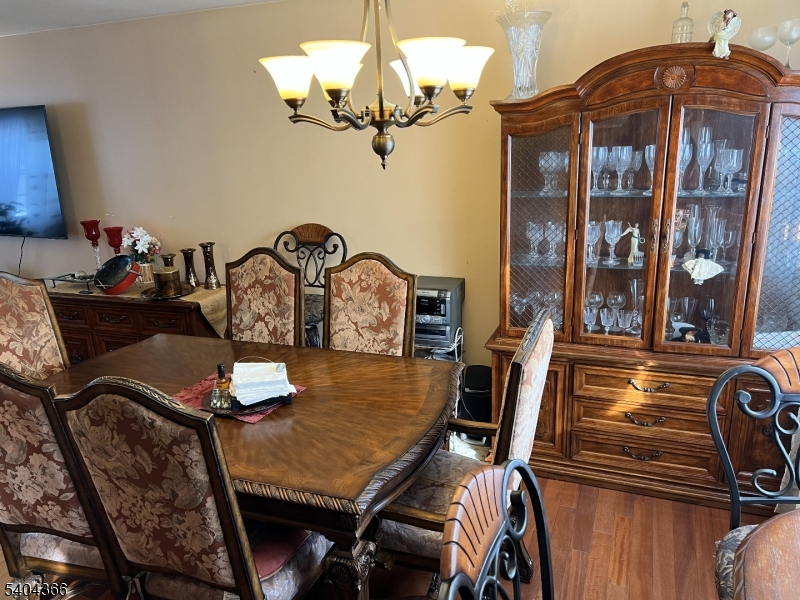 415 Wheatsheaf Road Roselle, NJ 07203 - Photo 16 of 30 a view of a dining room with furniture and chandelier