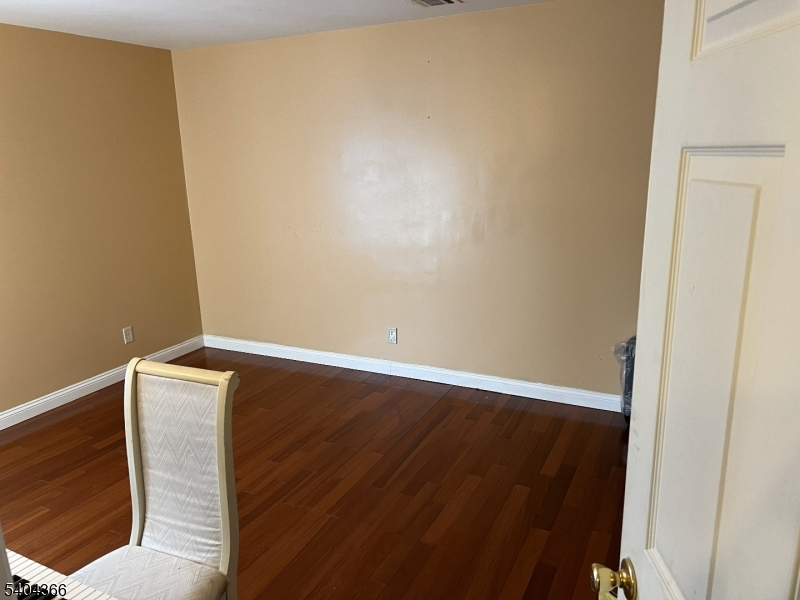 415 Wheatsheaf Road Roselle, NJ 07203 - Photo 21 of 30 a view of room with wooden floor