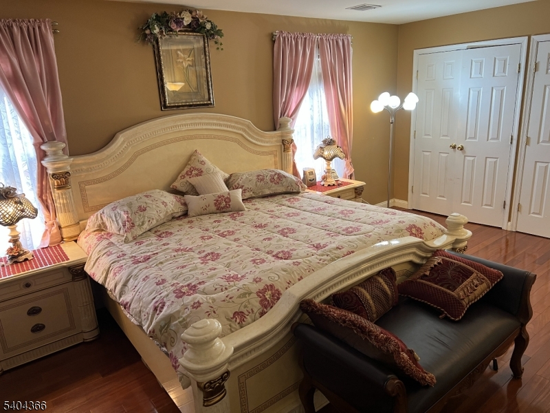 415 Wheatsheaf Road Roselle, NJ 07203 - Photo 25 of 30 a bedroom with a bed and a dresser