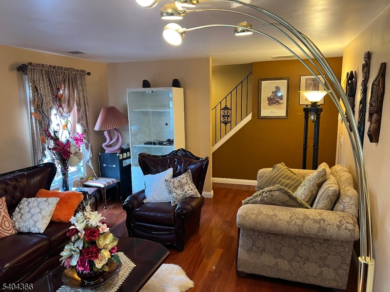 415 Wheatsheaf Road Roselle, NJ 07203 - Photo 5 of 30 a living room with furniture and a potted plant