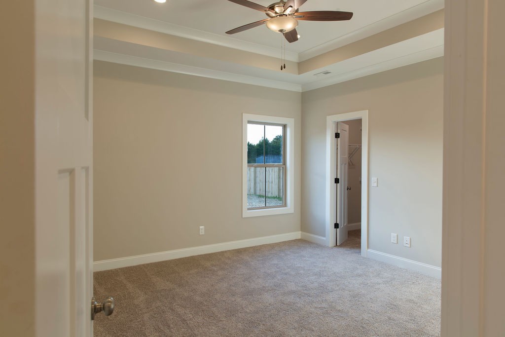 2348 Allen Ferry Road Smithville, TN 37166 - Photo 12 of 23 an empty room with a ceiling fan and a window