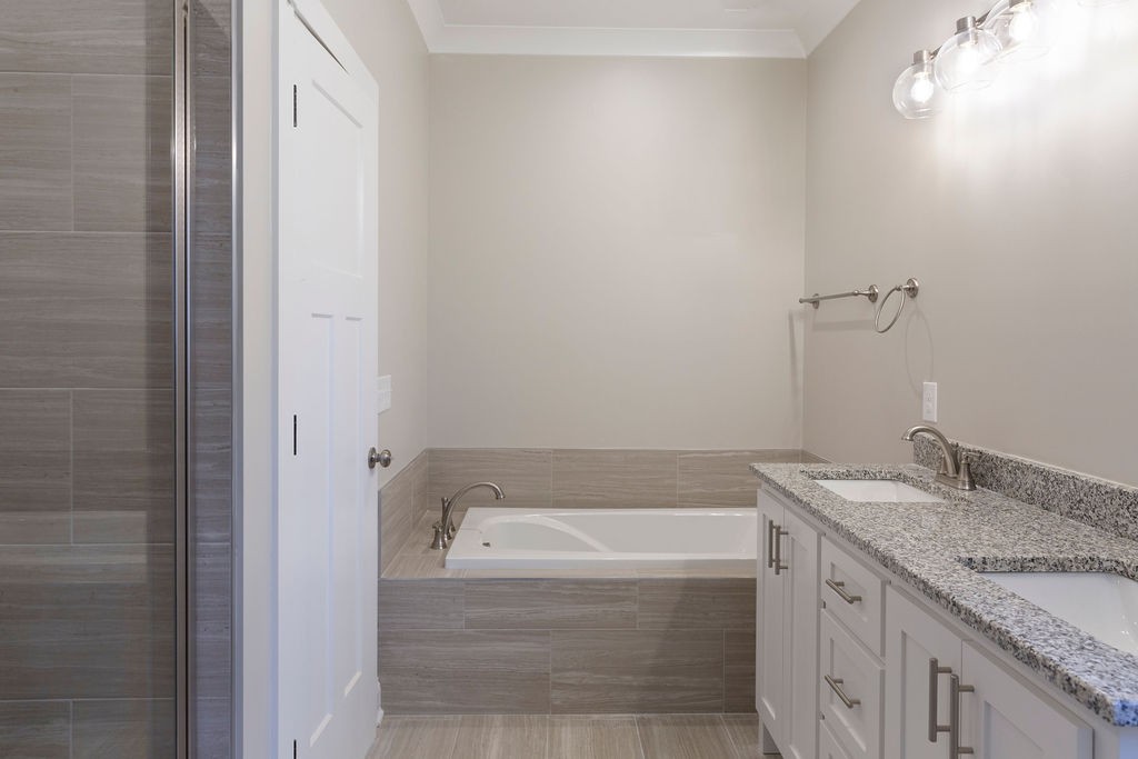 2348 Allen Ferry Road Smithville, TN 37166 - Photo 13 of 23 a bathroom with a granite countertop sink and bathtub