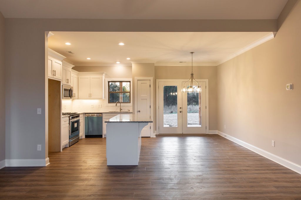 2348 Allen Ferry Road Smithville, TN 37166 - Photo 10 of 23 a view of kitchen with stainless steel appliances granite countertop a stove top oven a sink dishwasher a refrigerator and white cabinets with wooden floor