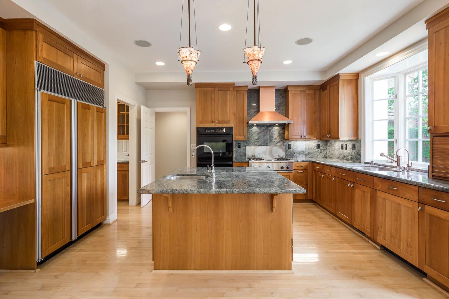 290 Gloria Circle Menlo Park, CA 94025 - Photo 17 of 41 a large kitchen with kitchen island a large counter top stainless steel appliances and cabinets