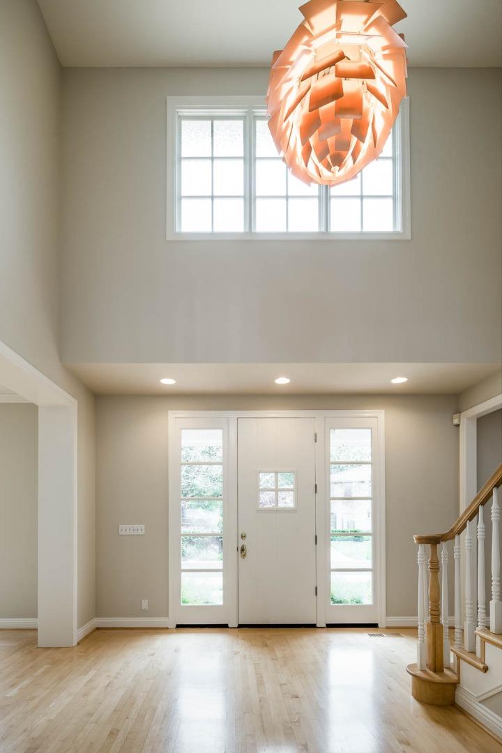 290 Gloria Circle Menlo Park, CA 94025 - Photo 7 of 41 an empty room with wooden floor and windows