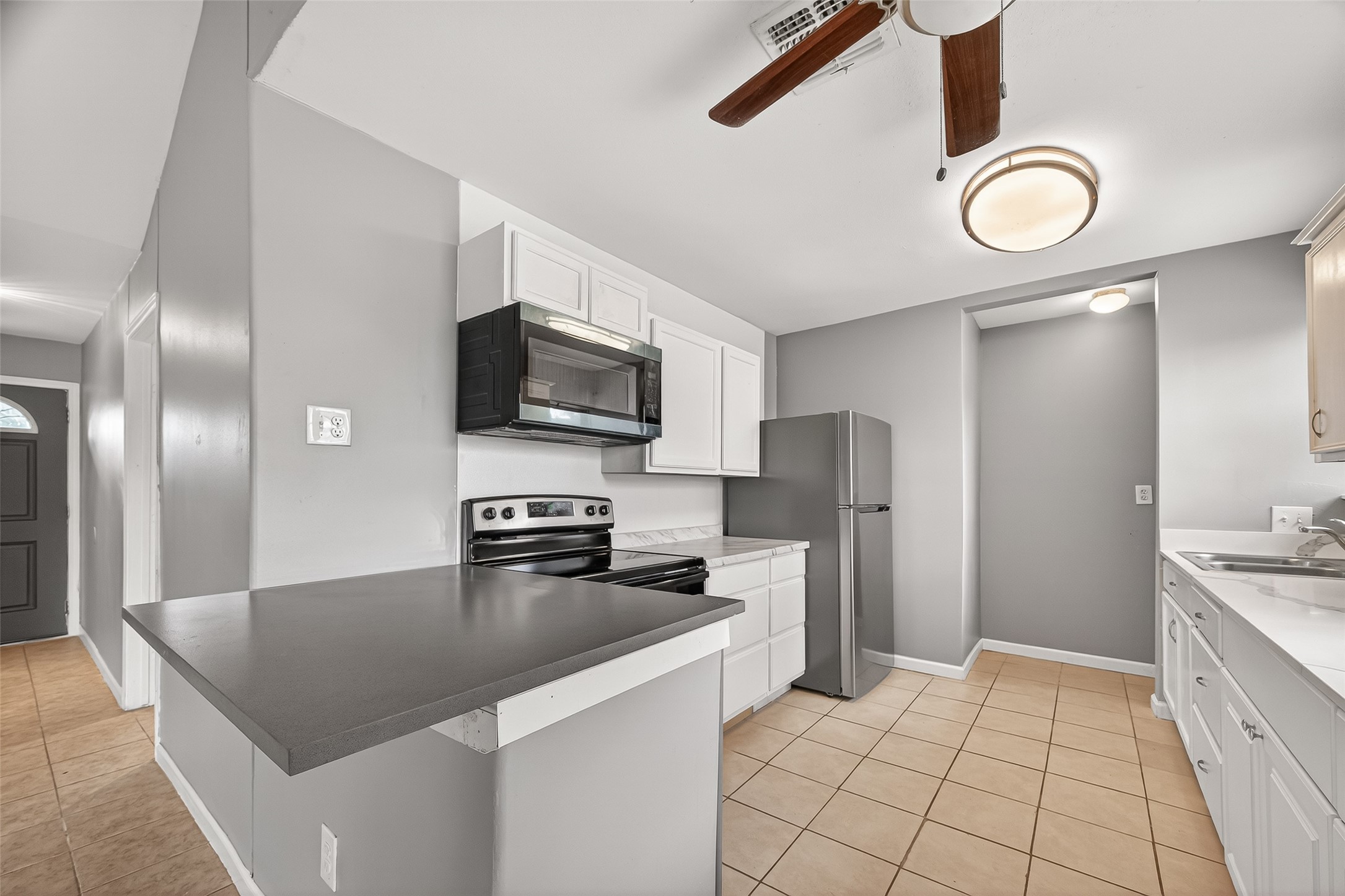 11927 Flushing Meadows Drive Houston, TX 77089 - Photo 8 of 36 a kitchen with stainless steel appliances granite countertop a refrigerator a stove top oven a sink and dishwasher