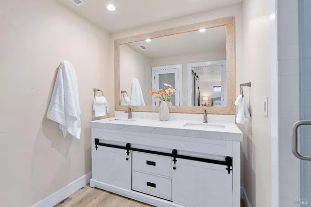 a bathroom with a sink and a mirror