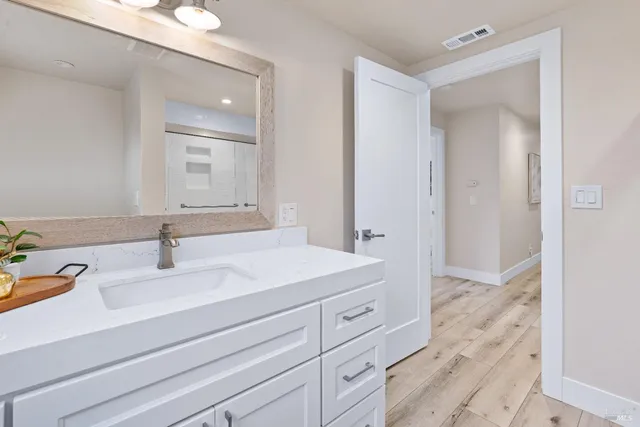 a bathroom with a sink and a mirror
