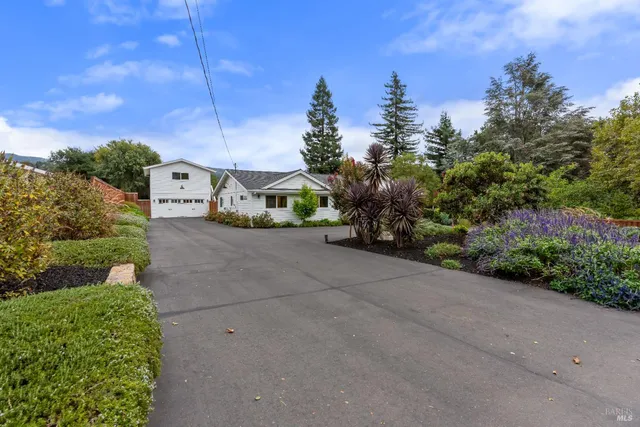 a view of a street with a building in the background