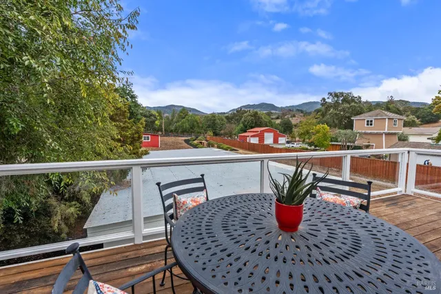 a view of a garden with a building in the background