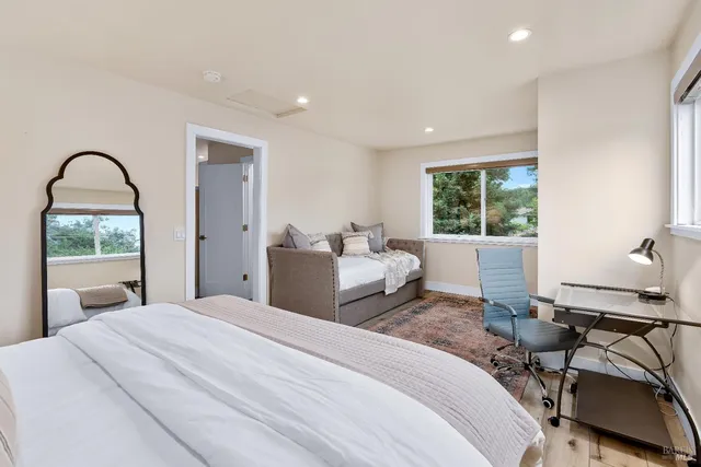 an aerial view of a house with a yard and a garage
