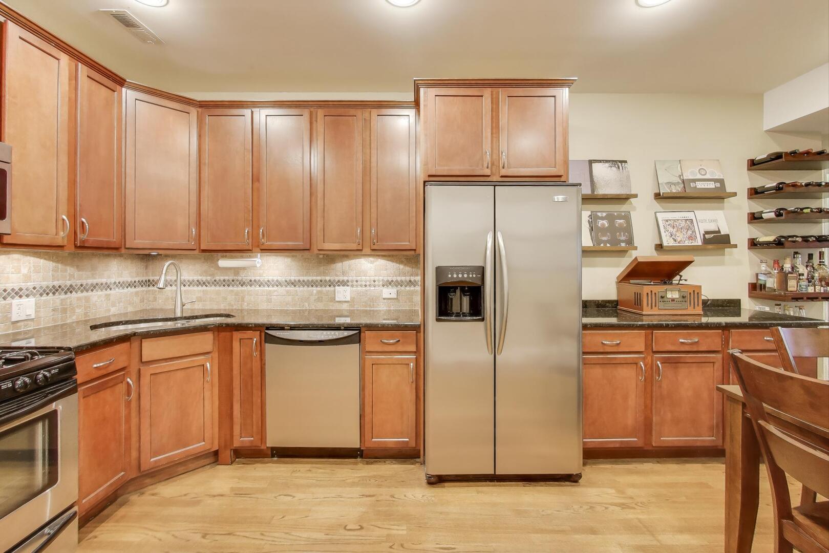 1378 North Wolcott Avenue, Unit 2C Chicago, IL 60622 - Photo 4 of 15 a kitchen with stainless steel appliances granite countertop a refrigerator and a stove top oven