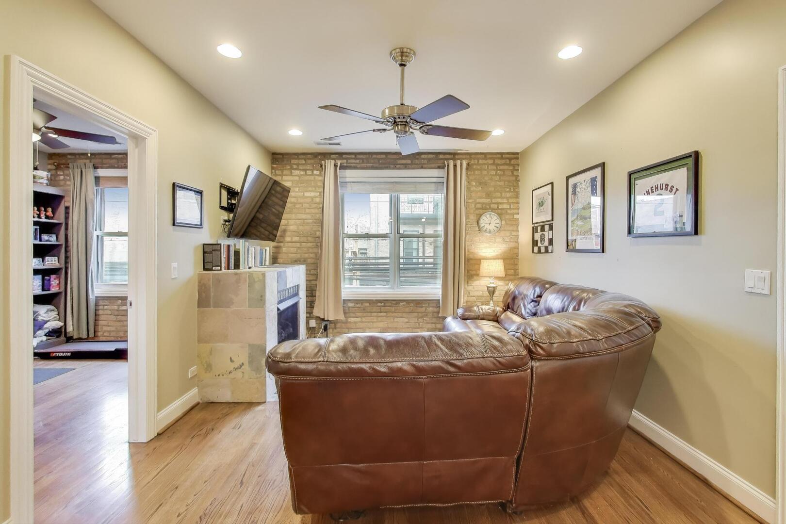 1378 North Wolcott Avenue, Unit 2C Chicago, IL 60622 - Photo 5 of 15 a bed room with furniture and window