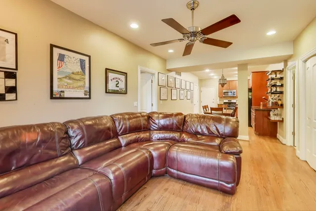 a view of a livingroom with furniture and a ceiling fan