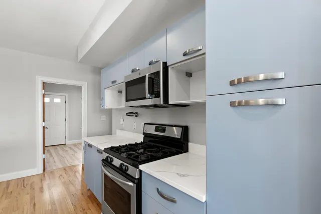 a kitchen with a stove and a microwave