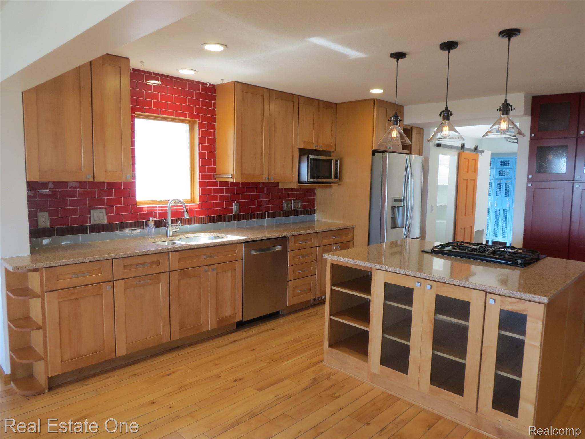 4583 Allen Cove Road Luna Pier, MI 48157 - Photo 16 of 50 Center Island with built in gas range.